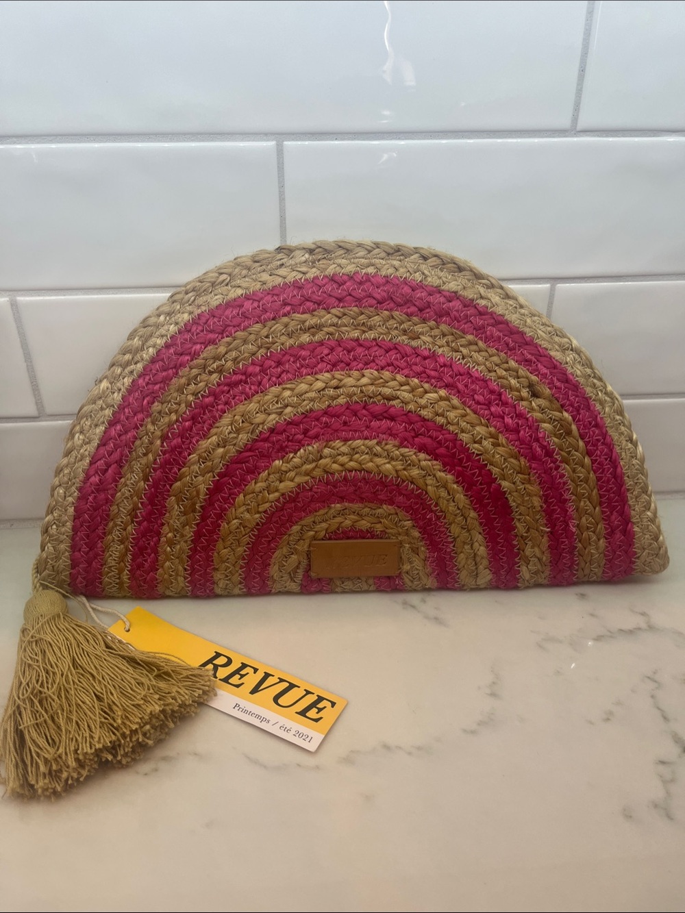 Revue brand half-moon Woven Straw Clutch in Pink and Natural